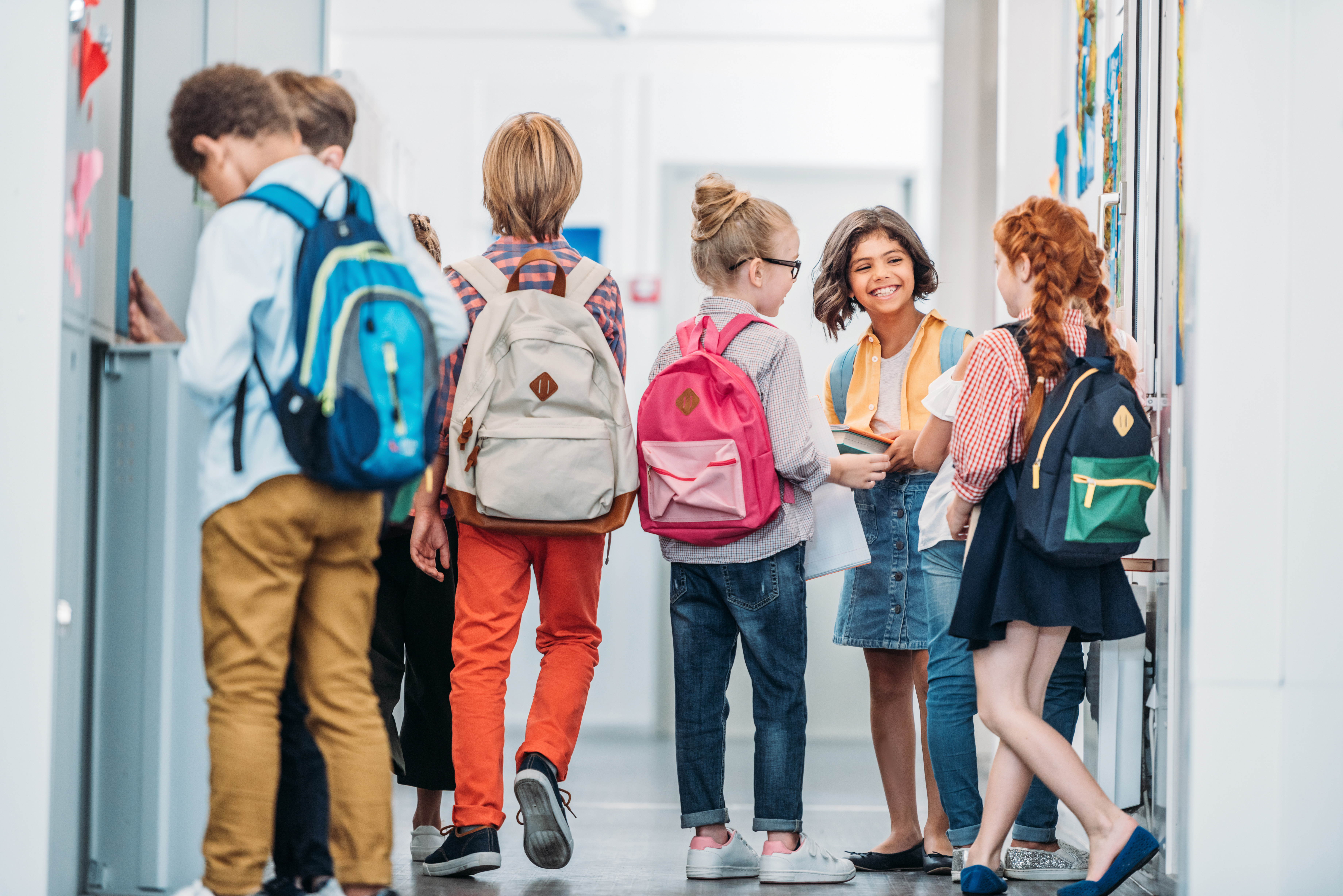 adorable little kids in school corridor